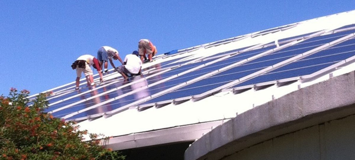 workers install solar panels at the uf/ifas extension sarasota county office