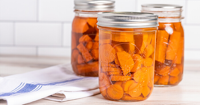 Caning jars with carrots inside