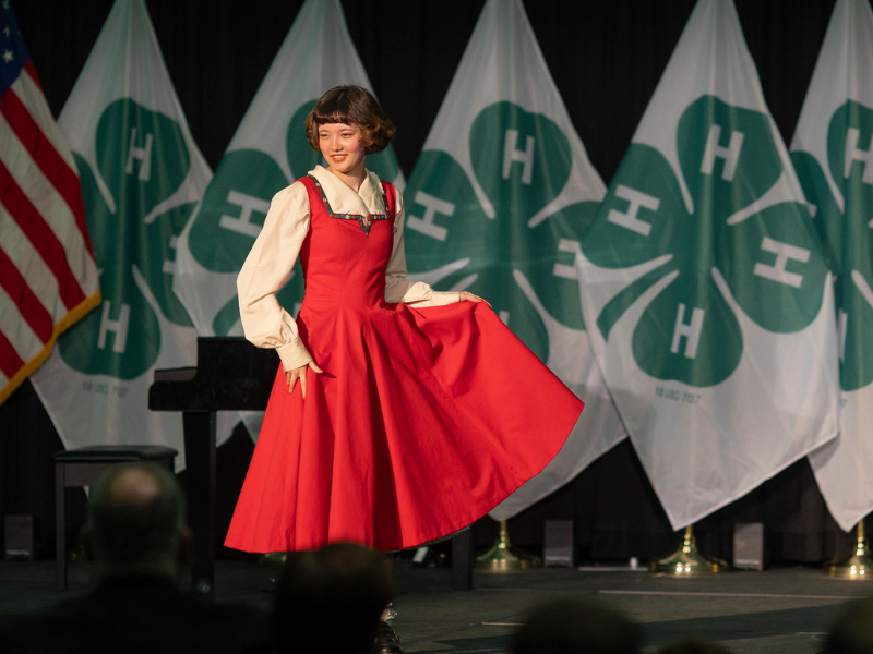 member showing red dress