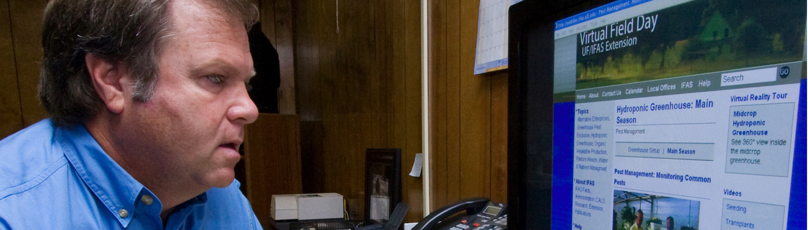 A person looking up information on a computer