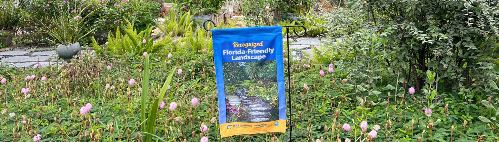 florida friendly landscaping banner in a yard