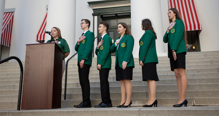 A group of 4-H teens on the steps of the Florida State Capitol building.