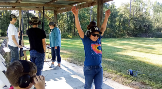 Excited 4-H member at a 4-H Shooting Sports practice