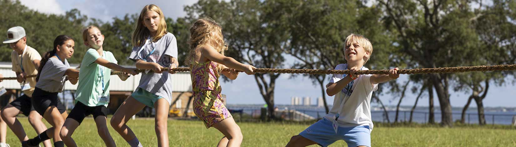 A group of 4-H kids playing tug of war.