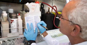 Man reading pesticide lable