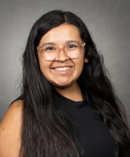 headshot of Clarrisa Chairez with braids and blue glasses