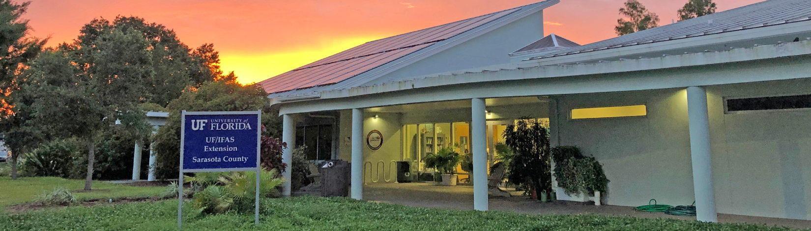 The sun sets behind the UF/IFAS Extension Sarasota County office at Twin Lakes Park