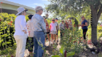 a master gardener volunteer leads a tour of demonstration gardens at sarasota county extension