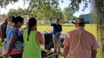 a sarasota county extension agent leads a composting workshop in an on-site, outdoor setting