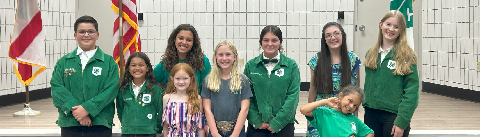 kids in front of a stage side by side