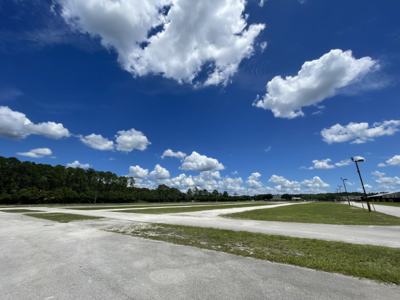 View of large semi-paved field